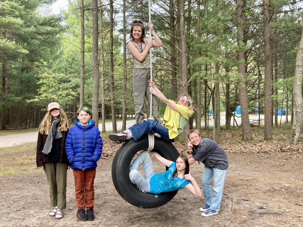 Youth on Tire Swing at Family Camp